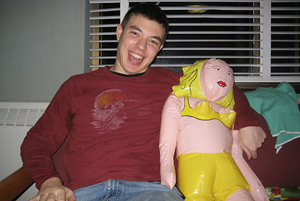 Happy with a blow-up doll